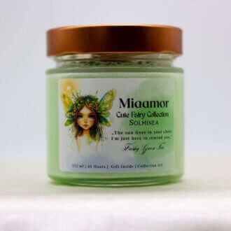 Solminea candle with peridot and green aventurine crystals on top, sparkling with light and surrounded by fresh greenery.